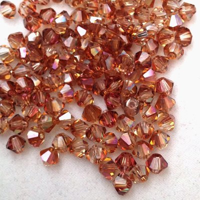 Xilion Bicone - Crystal Copper - 3 mm, 20 ks